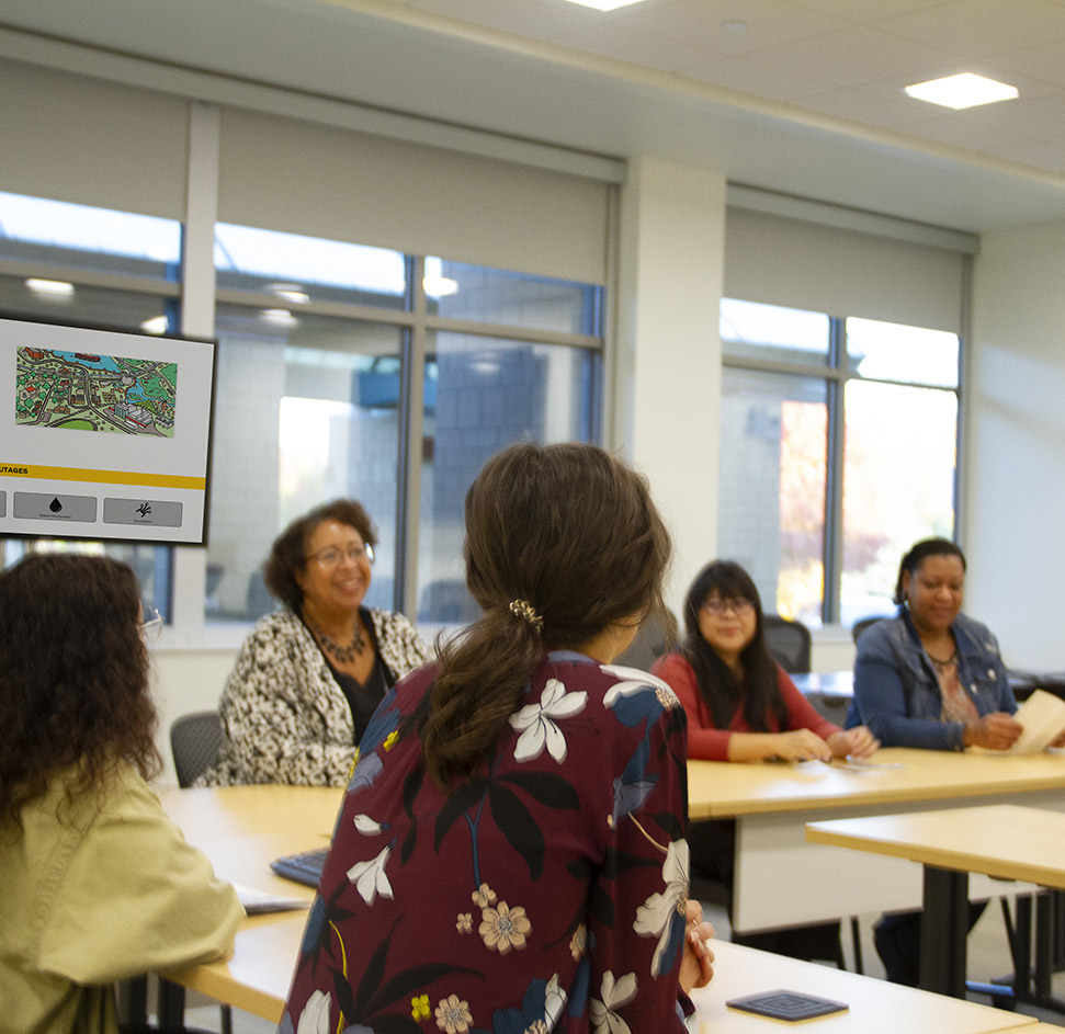 A meeting with five female office workers