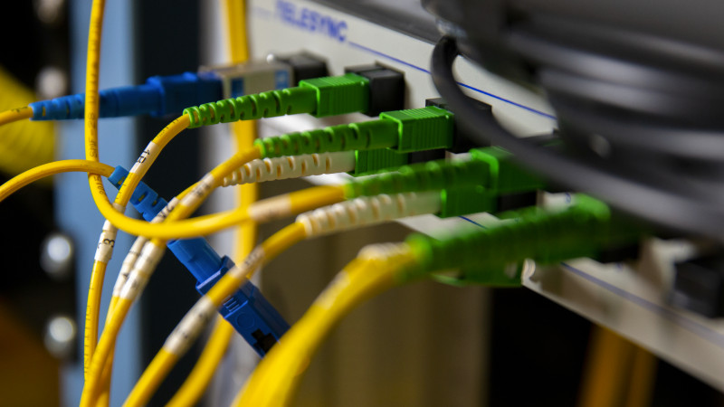 Fiber optic cables plugged into a box