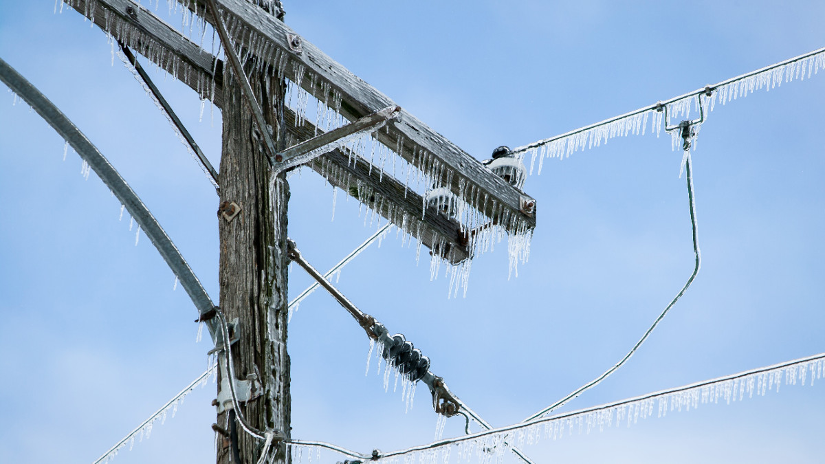 Iced over powerlines and utility pole.