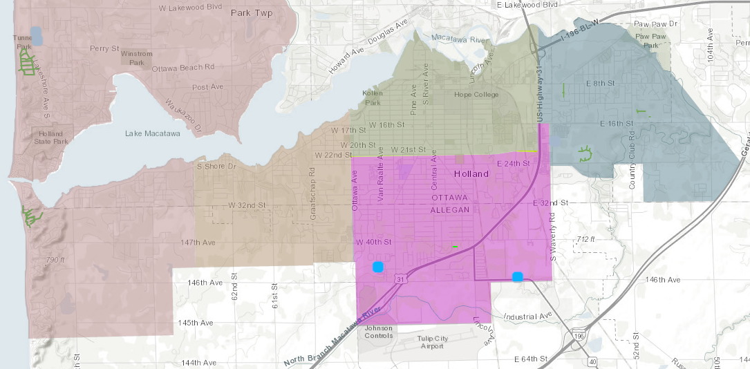 A map highlights the area in Holland, MI that will experience water main flushing. The target area is indicated by a bright purple color. Areas not being flushed are in muted color tones.