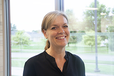 female executive wearing a black shirt