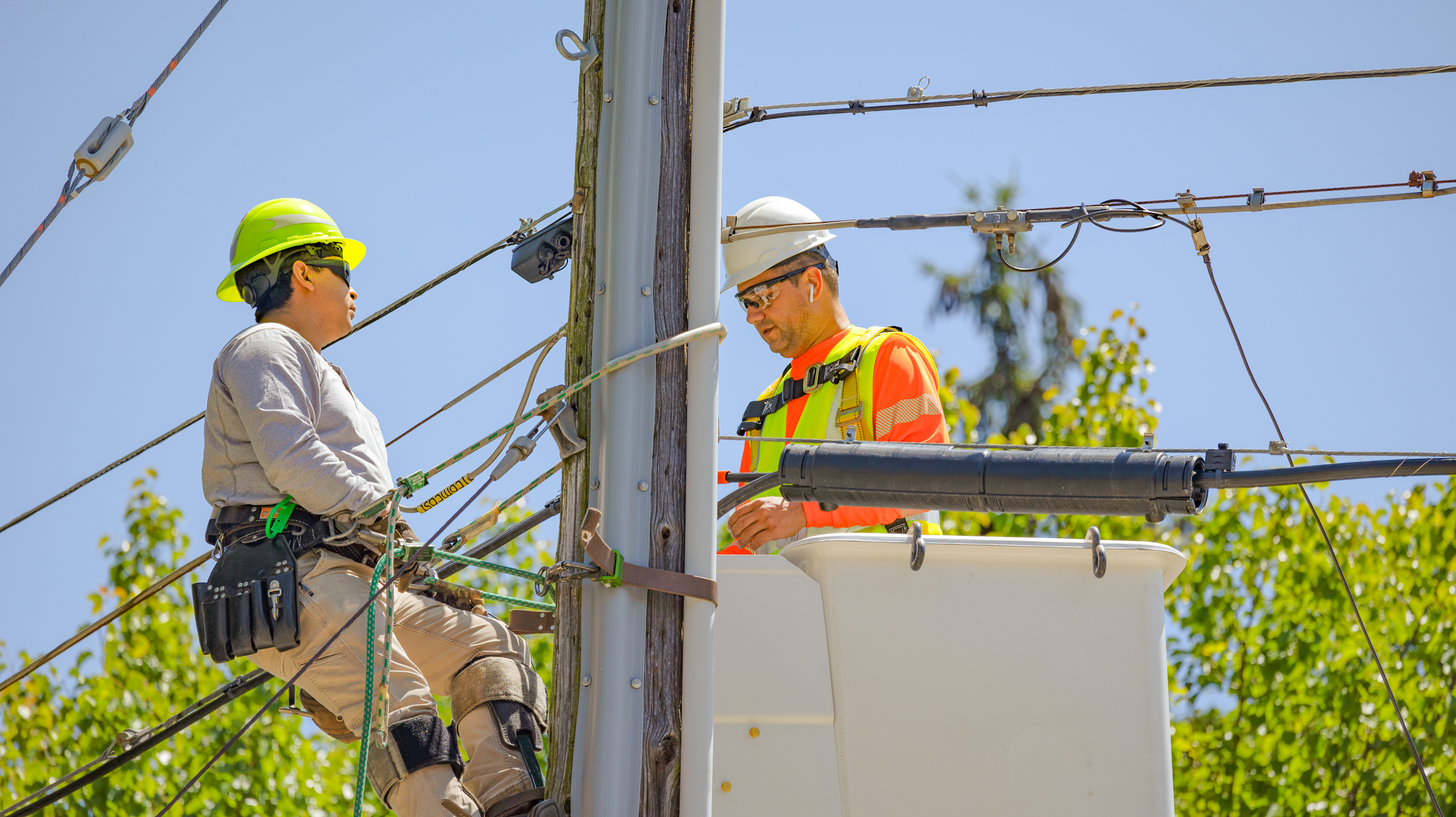 fiber technicians install overhead lines