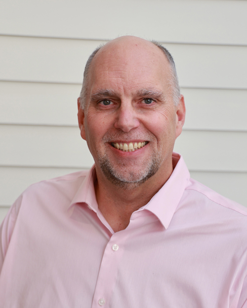 male executive wearing a pink button down