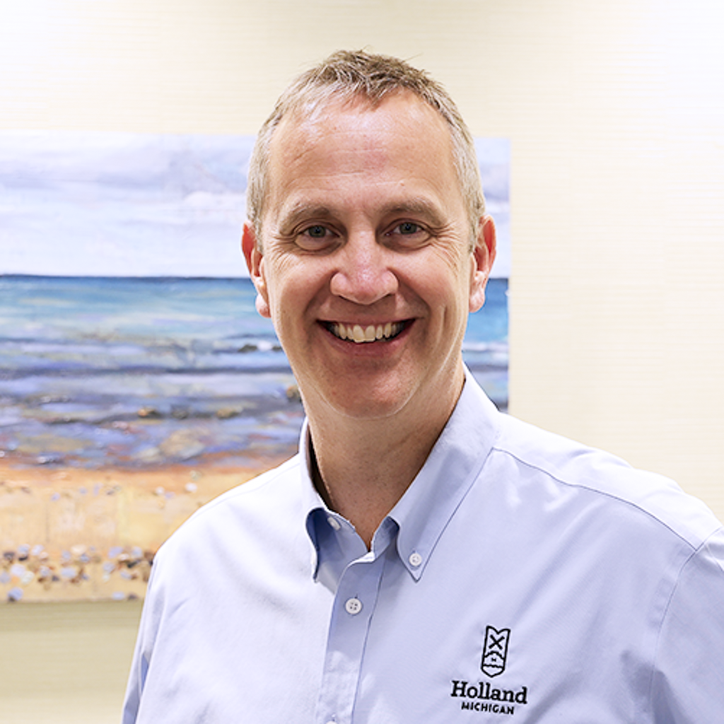 male executive wearing a blue grey City of Holland collared shirt